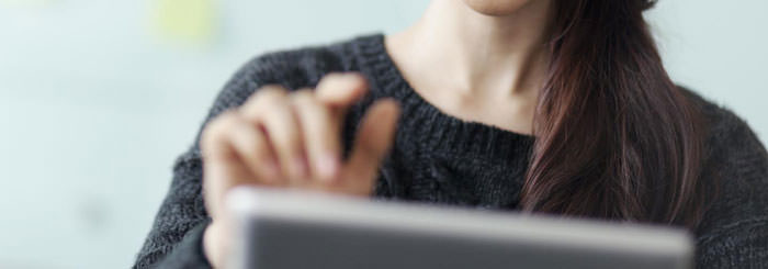 Woman uses tablet computer