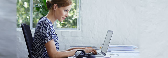 Woman using computer at desk