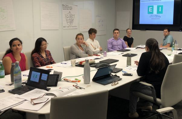 Photo of a group of interns in a meeting