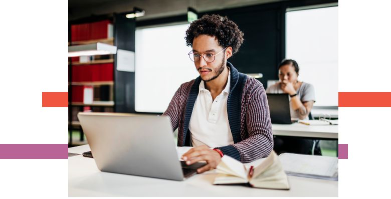 man looking at his laptop