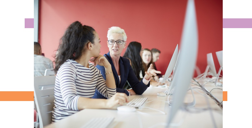 people talking while looking at a computer