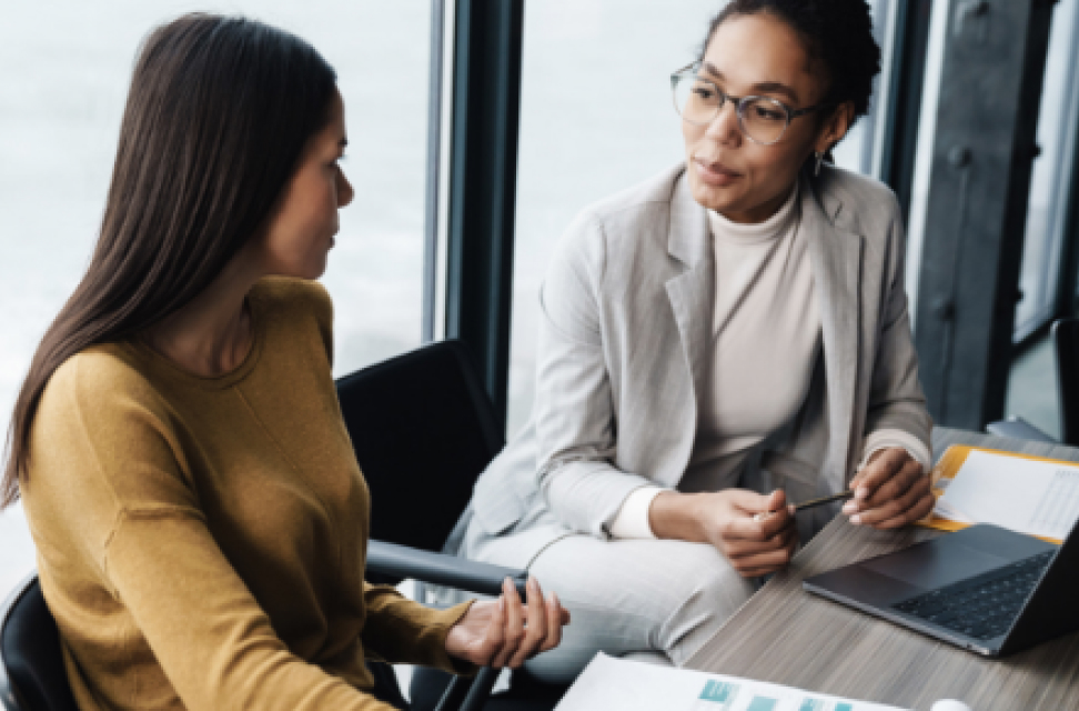 Photo of two people working together