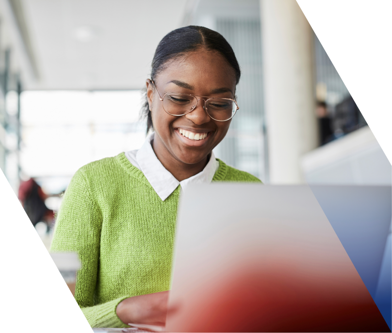Photo of a person working at a laptop