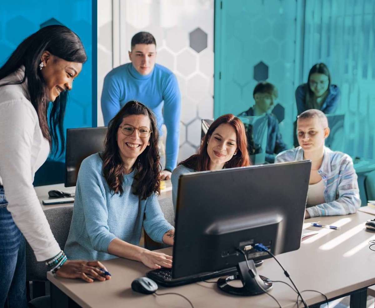 Group of people working together at a desk