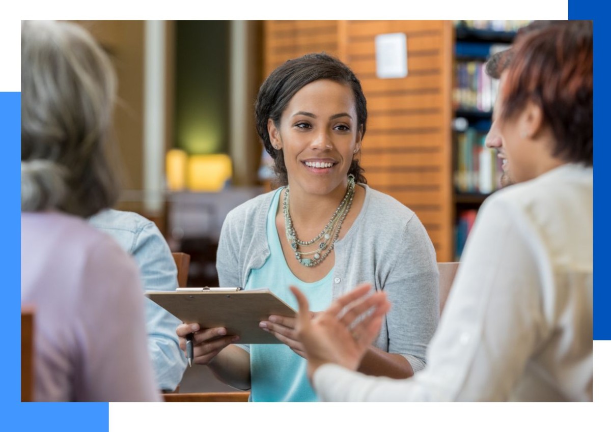Photo of three people talking