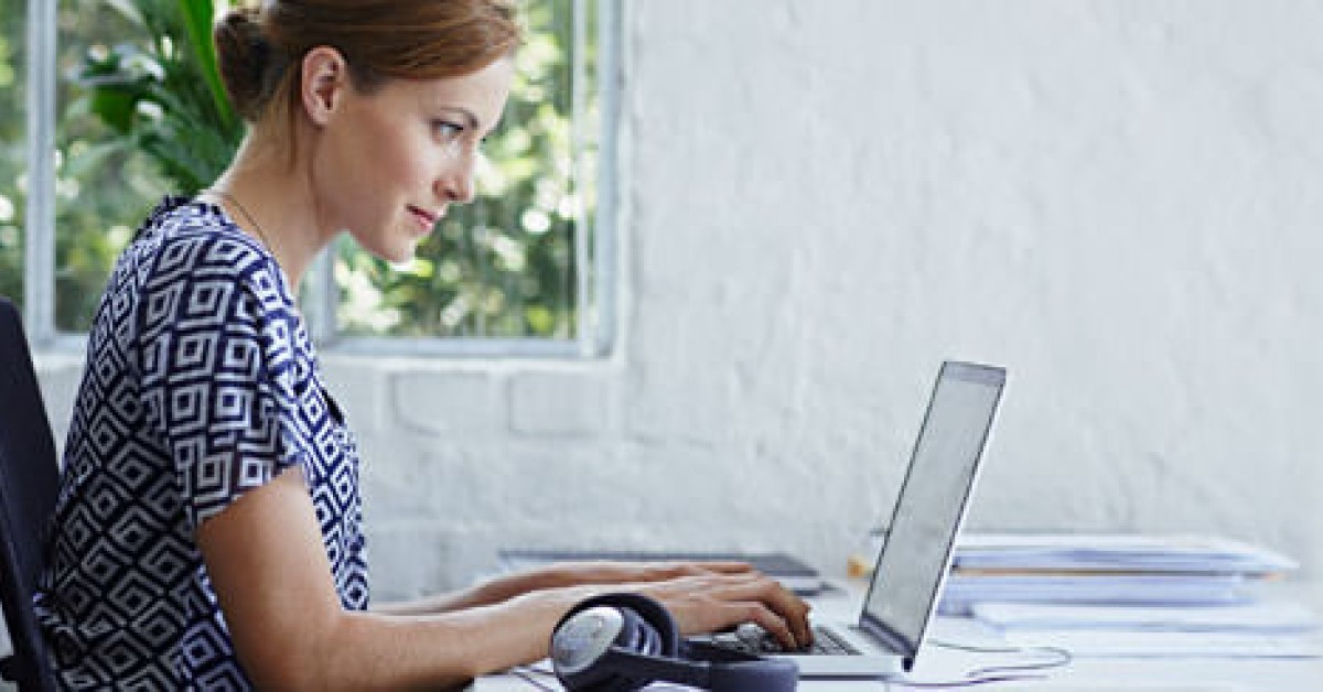 Woman using computer at desk