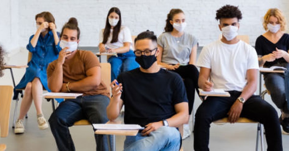 A group of students wearing face masks inside a classroom