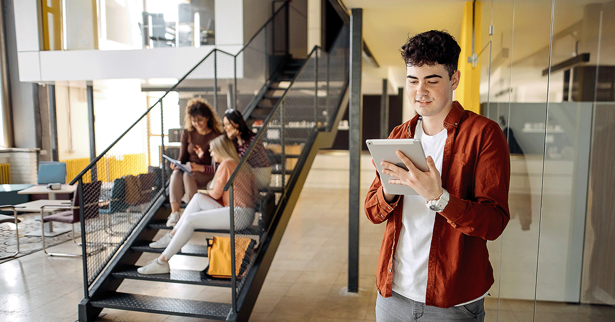 Students using tech on a campus