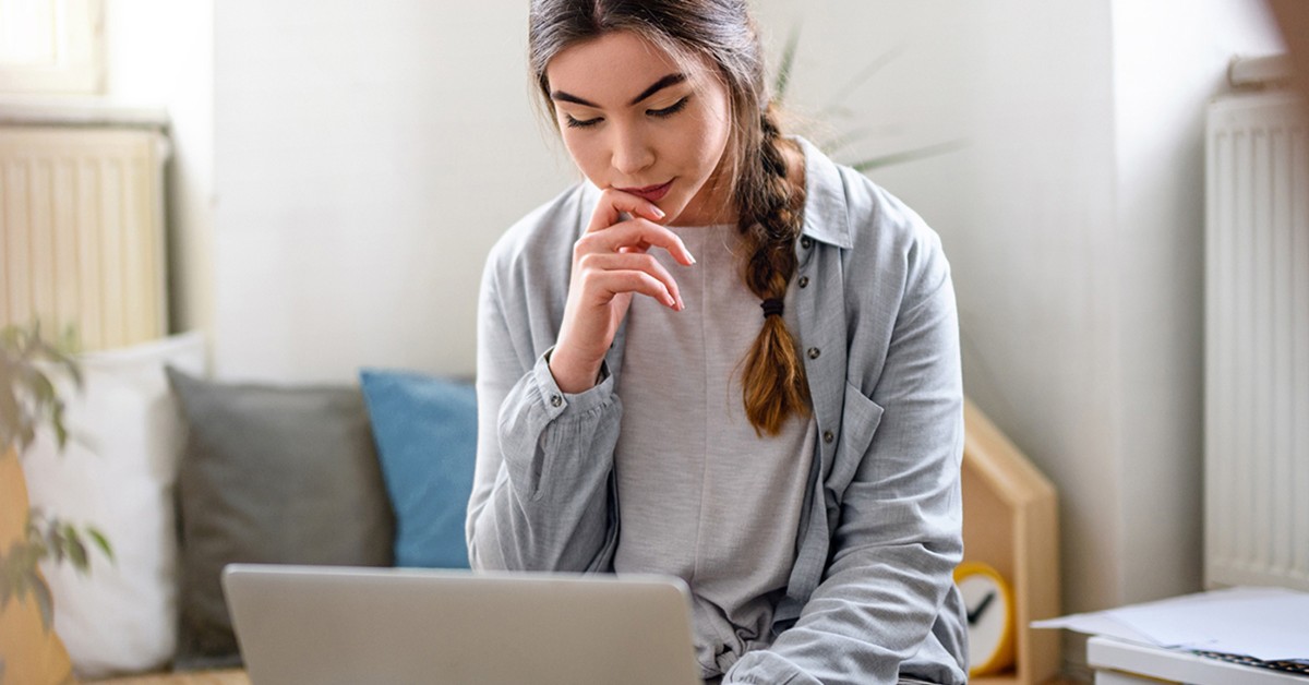 Photo of a woman working at a laptop