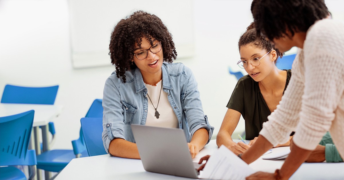 people collaborating on a project at a desk