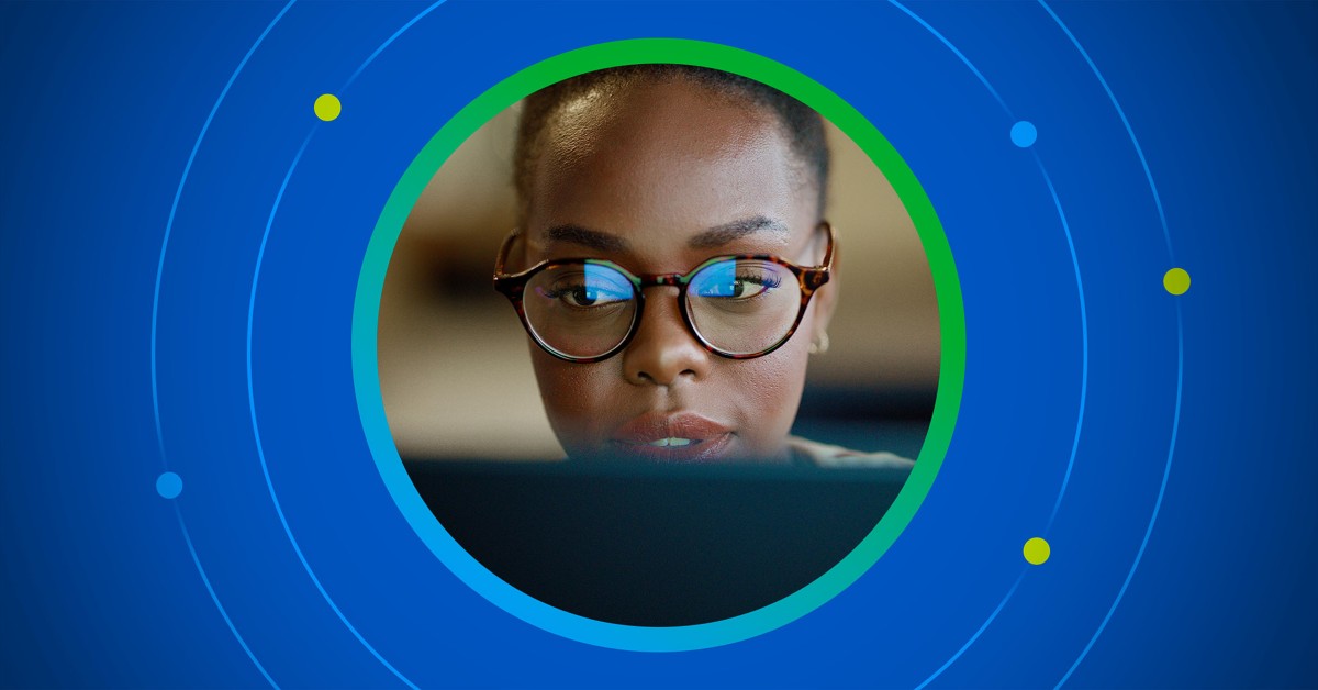 Stylized photo of a woman working at a laptop bringing the focus on her face