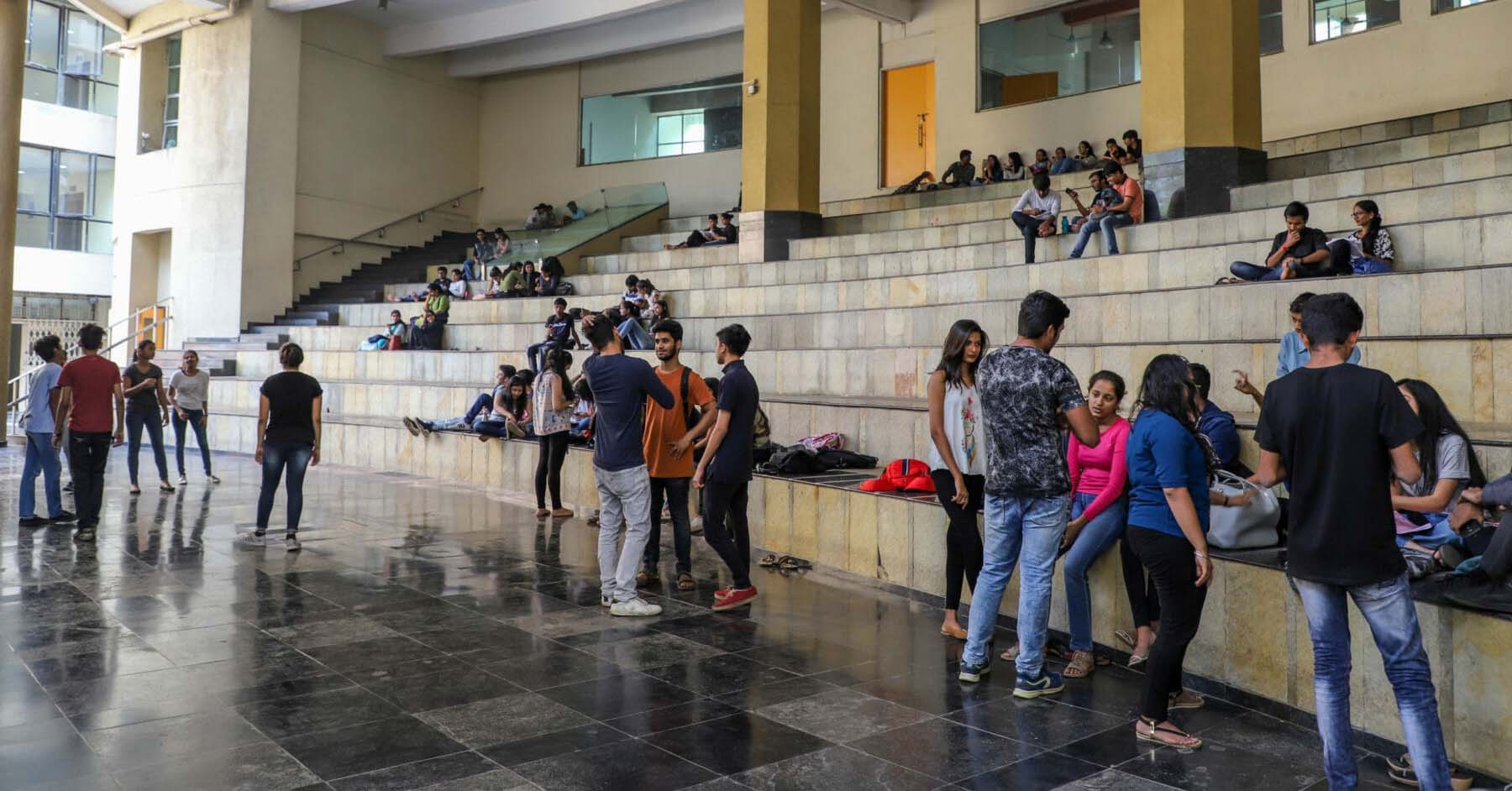 Photo of students gathered in a common area on campus