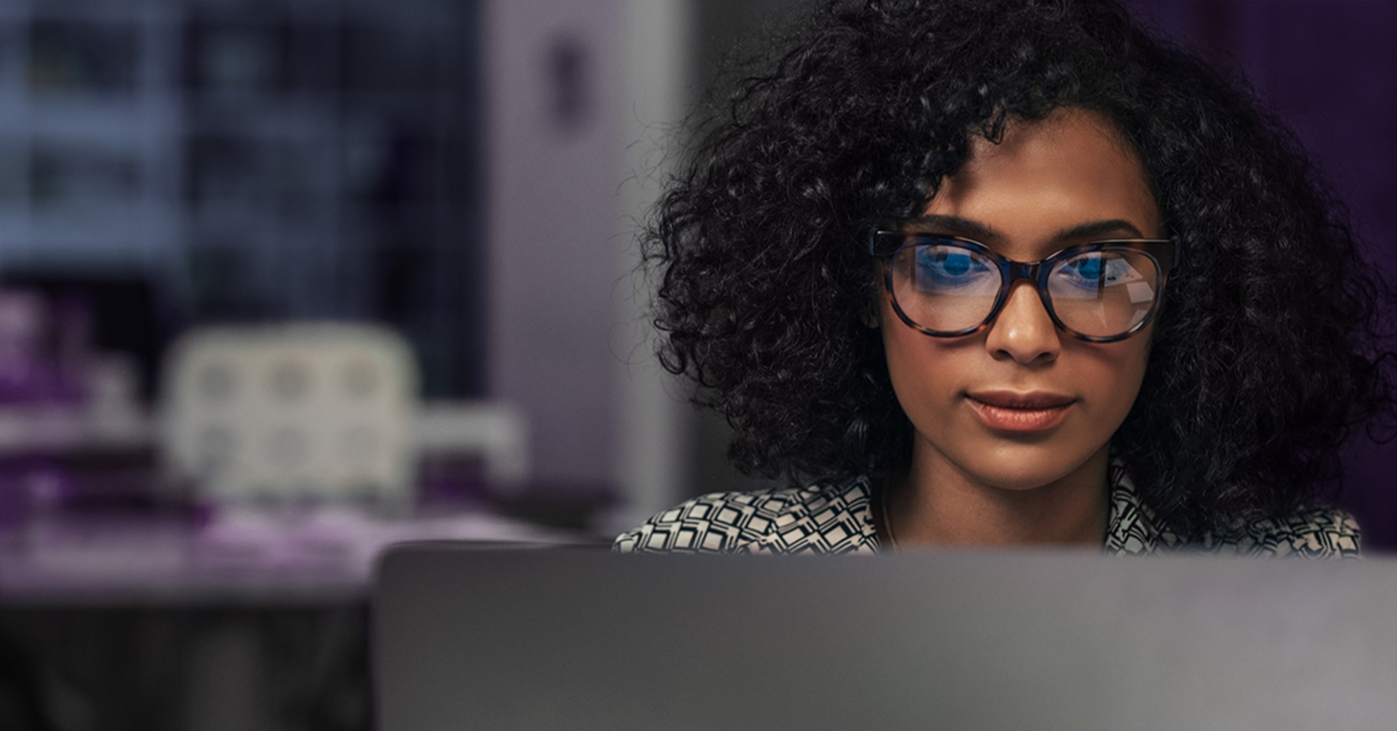 Photo of a woman working at her laptop