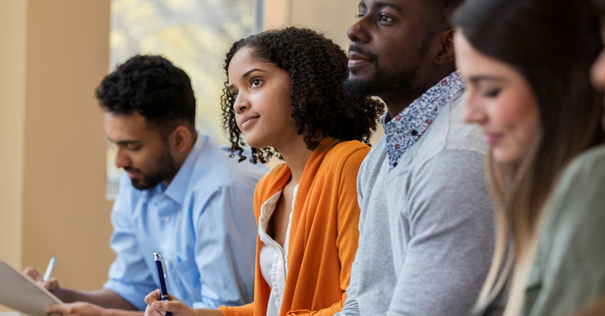 Photo of four people engaged in a training session