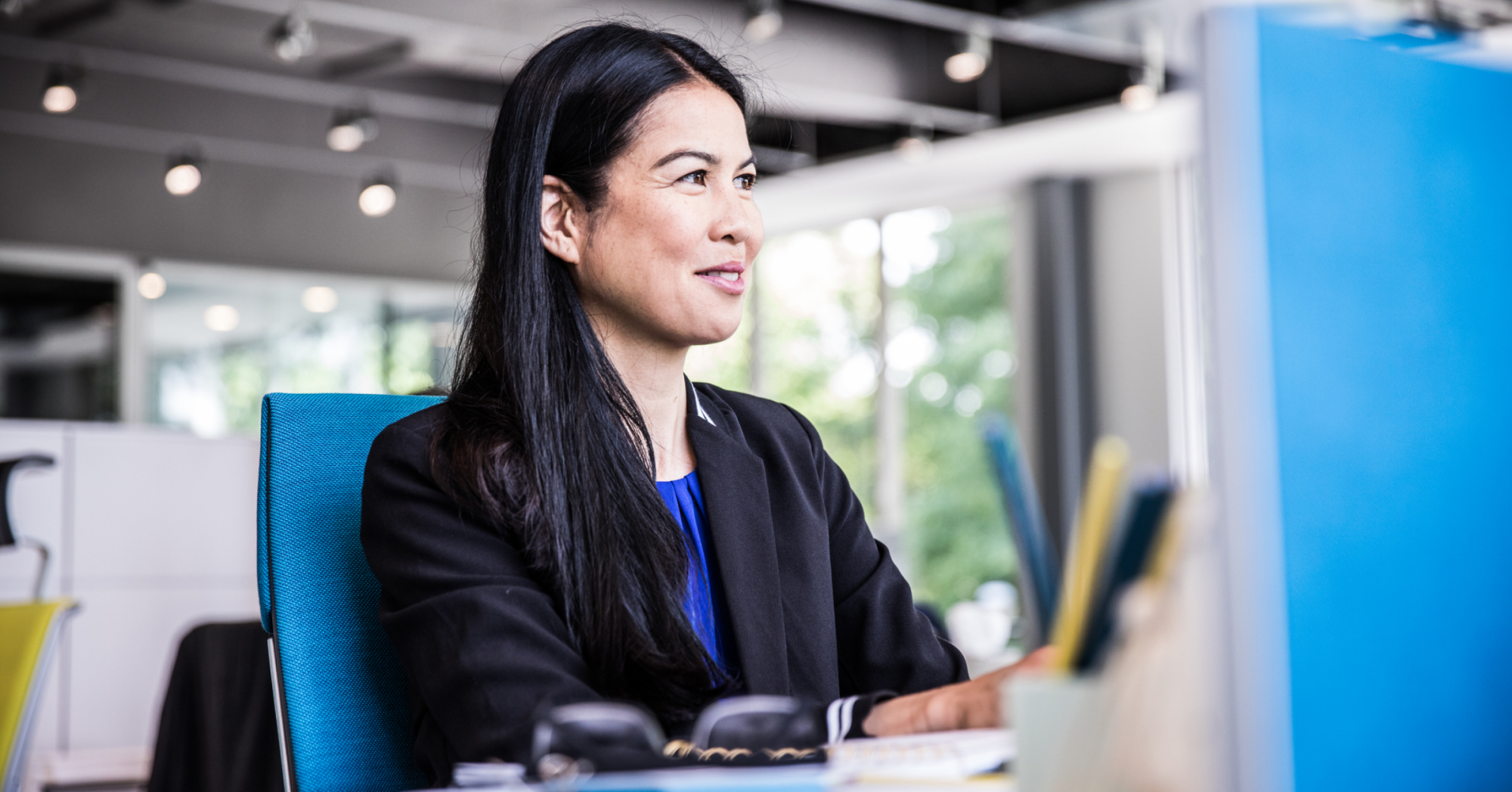 Photo of a woman working at her desk