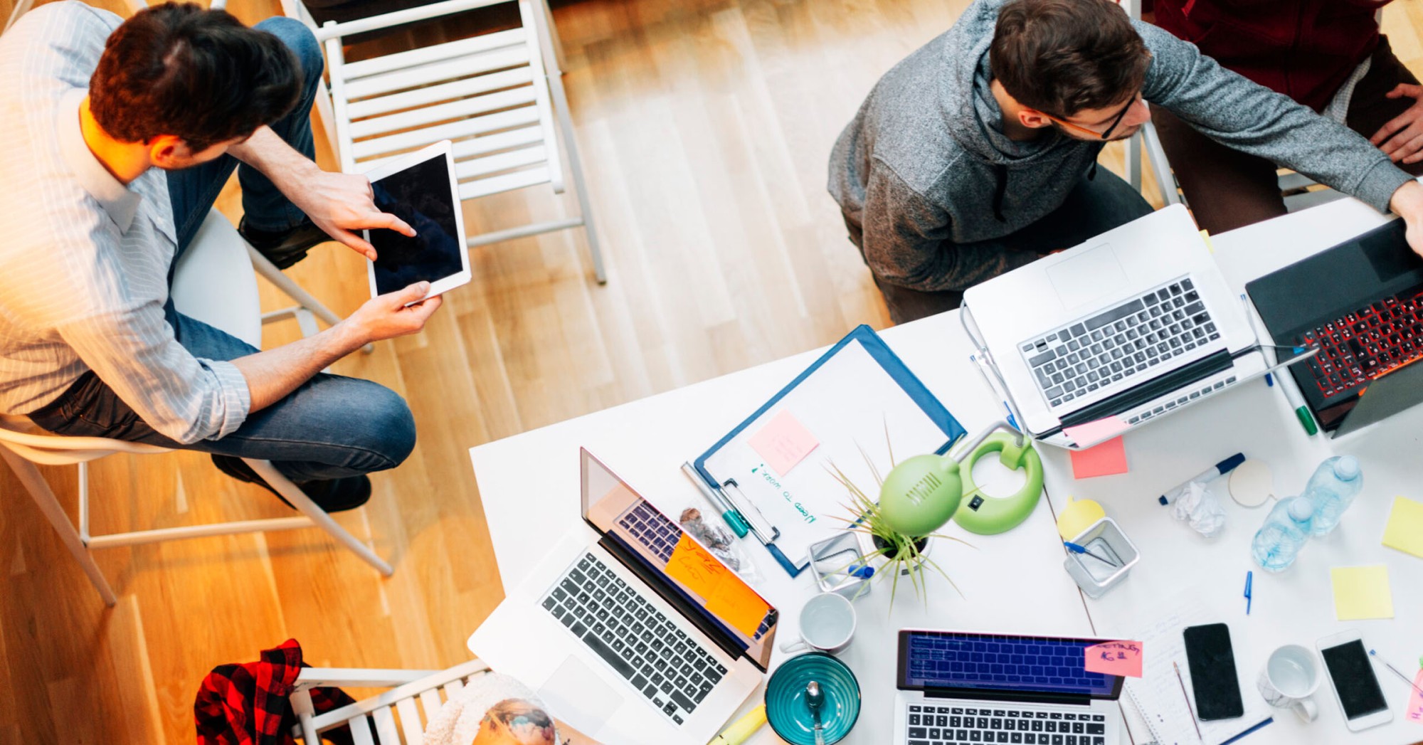 Overhead photo of people working around a table