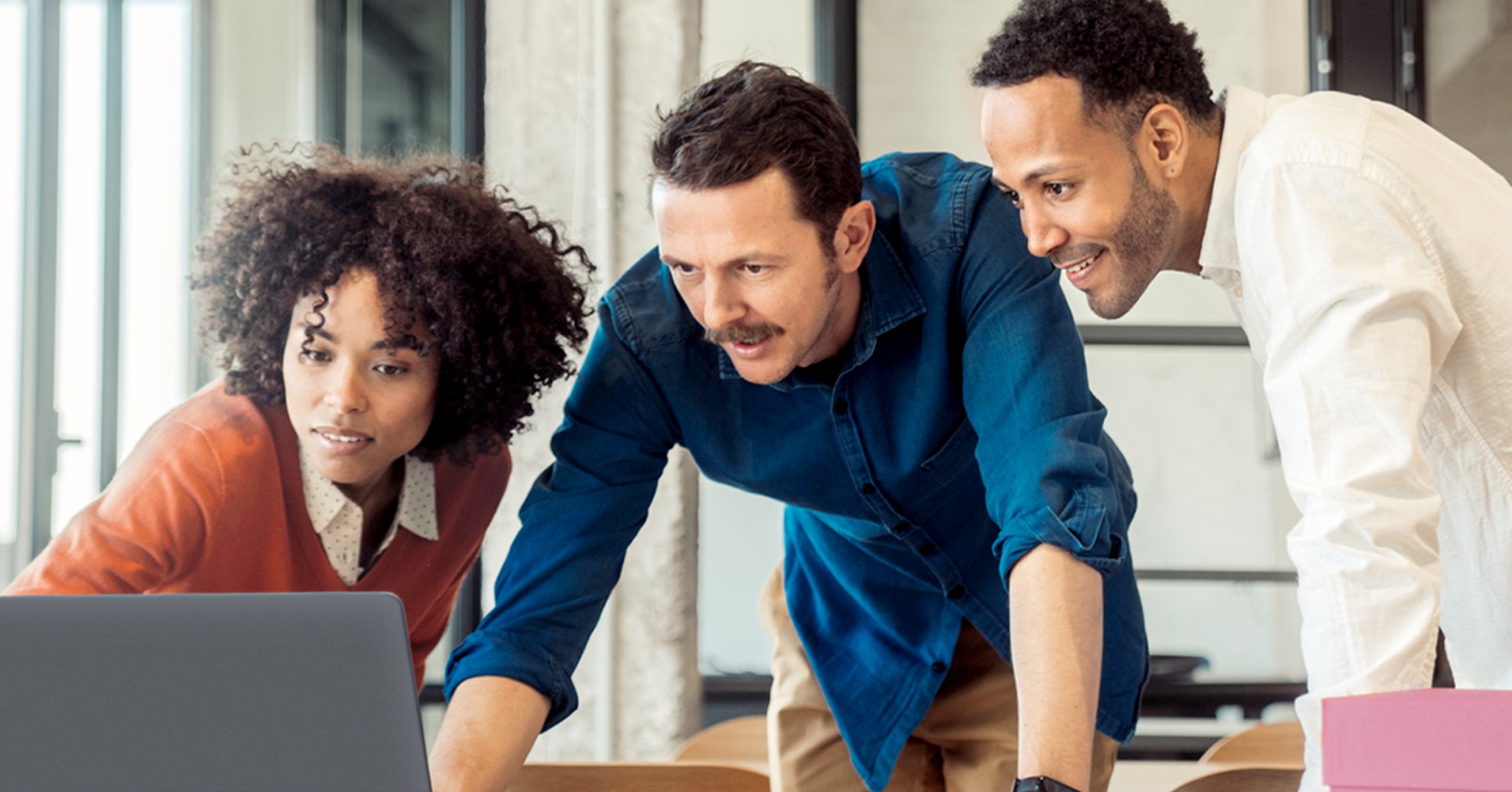 Workers looking at a computer