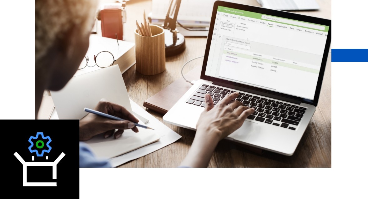 Closeup photo of a woman using Anthology Payroll on her laptop